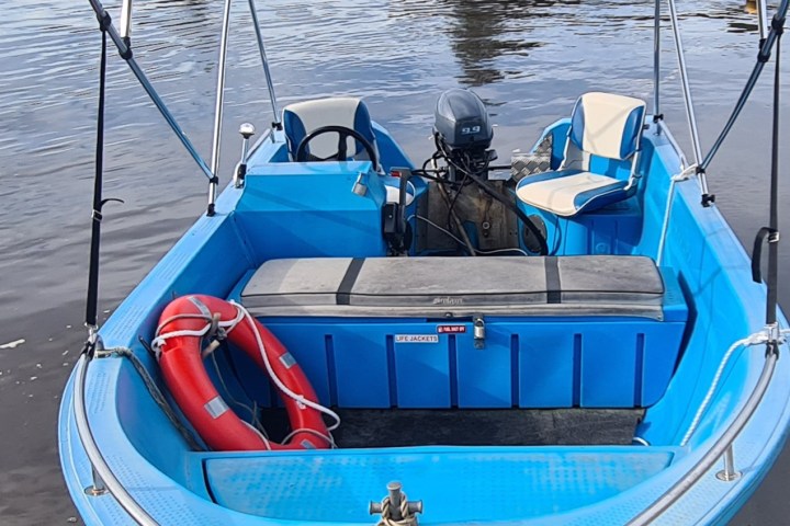 Polycraft 6 seat side console boat with canopy.