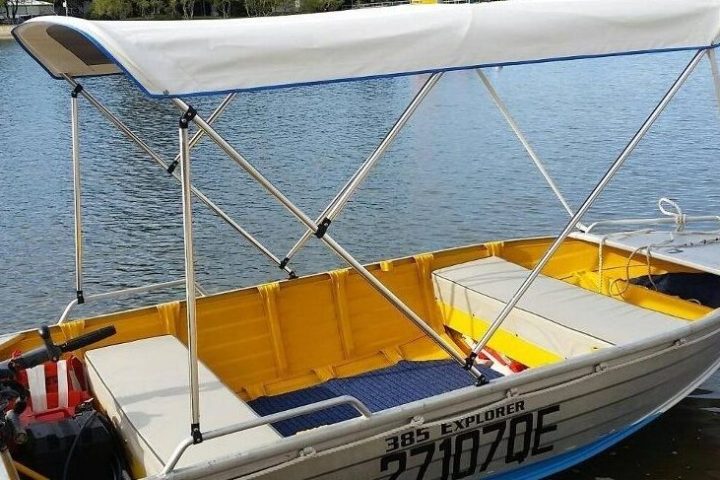 a boat sitting next to a body of water