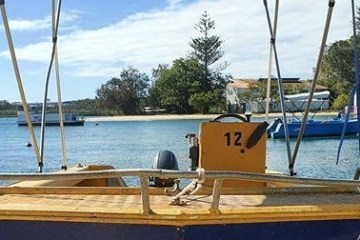 a wooden boat in a body of water