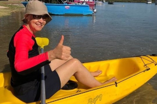 a man rowing a boat in the water