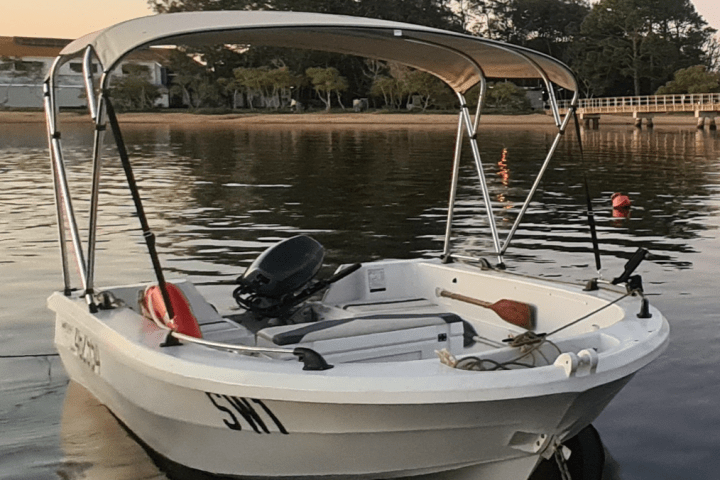 a small boat in a body of water