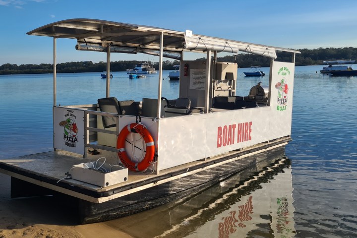 a boat is docked next to a body of water