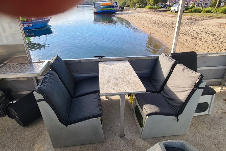 a boat sitting on top of a beach