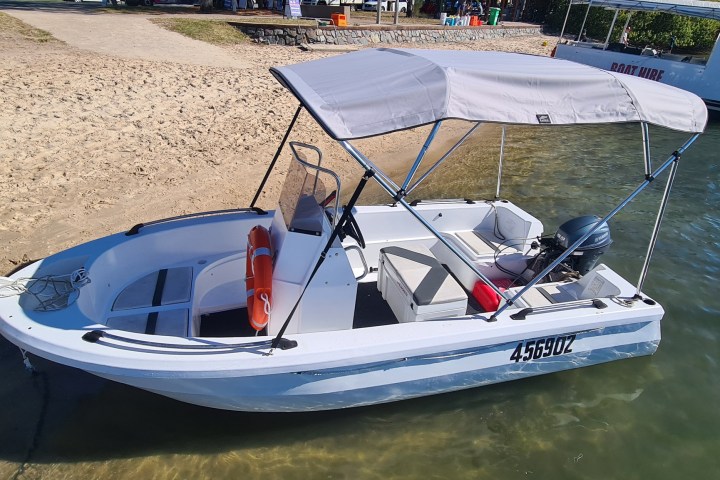 a small boat in a body of water