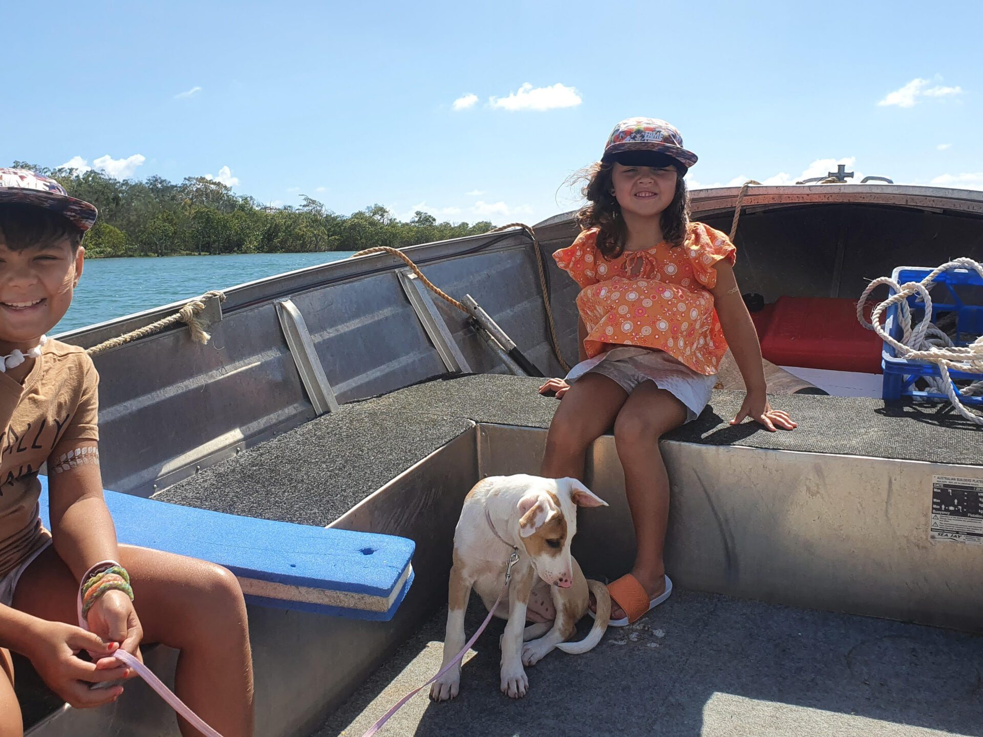 a woman sitting on a bench with a dog