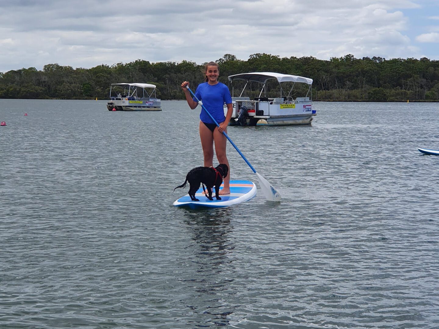 a man rowing a boat in a body of water