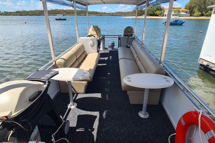 a boat that is sitting in front of a body of water