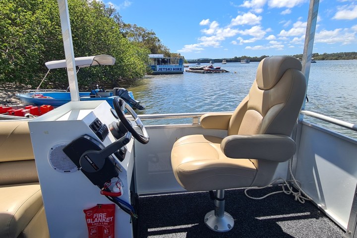 a boat parked next to a body of water