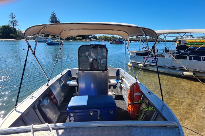 a boat is docked next to a body of water