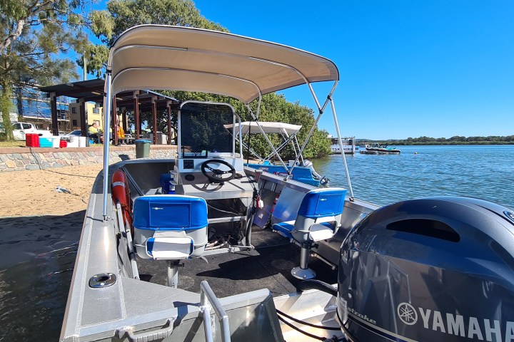 a boat sitting on top of a truck