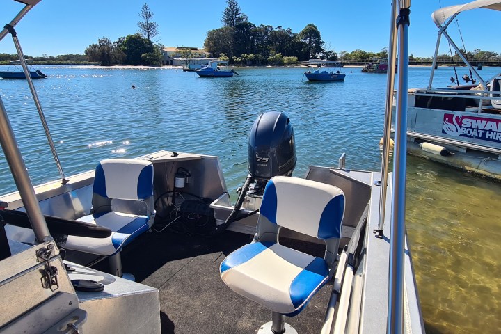 a boat is docked next to a body of water